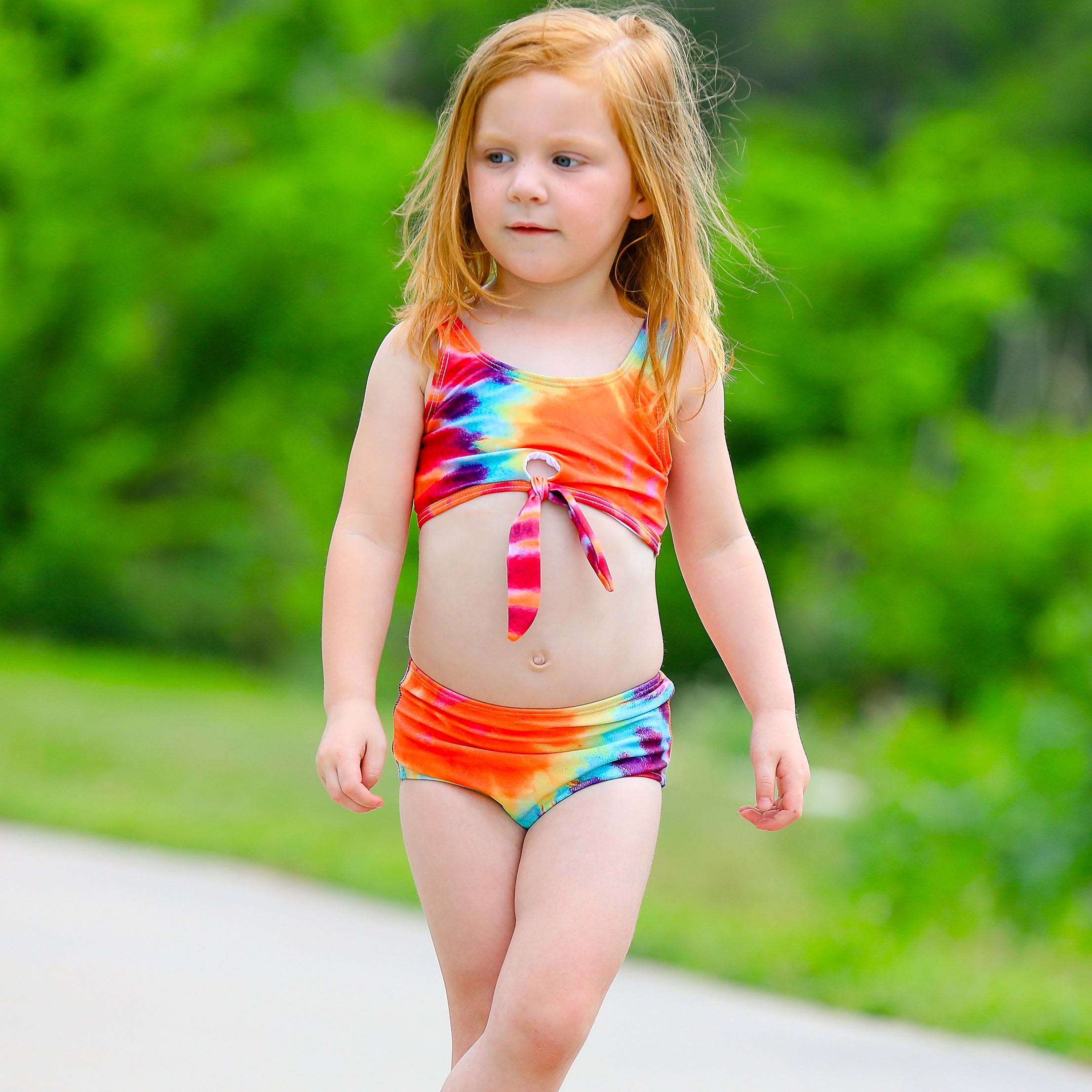 AL Limited Girls 2 piece Tie Dye Tankini Swimsuit featuring a rainbow swirl design with a tie knot tank top and high-waisted bottoms.